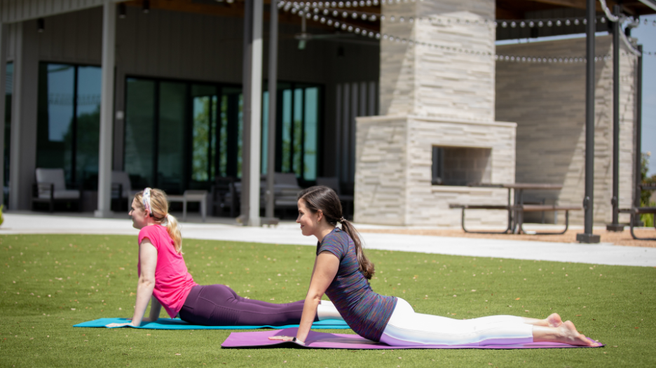 woman practicing outdoor yoga for Outdoor fall fun in Richmond TX